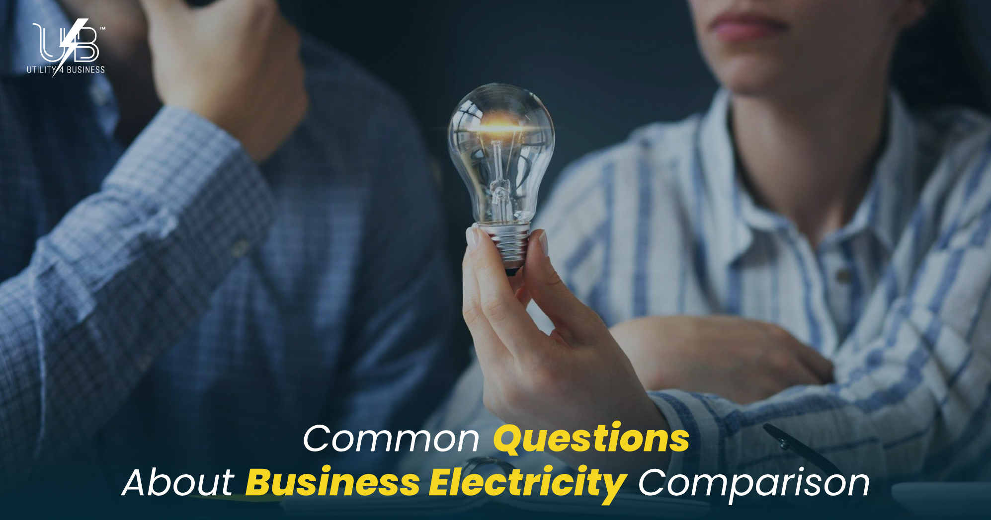 UK business electricity comparison, Utility4Business: compare rates, standing charges, VAT & CCL lightbulb held in meeting
